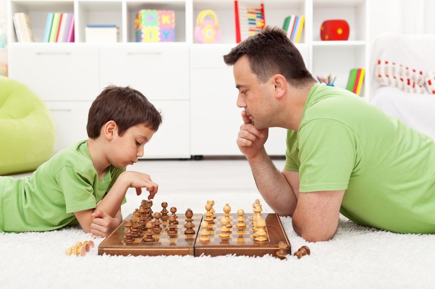 Father Child Playing Chess during Lockdown